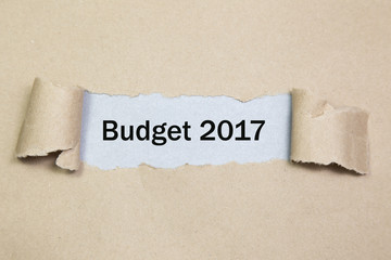 Text Budget 2017 appearing behind ripped paper
