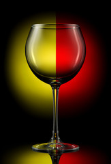 Empty wine glass on a color background.