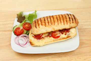 Pannini with garnish on a tabletop