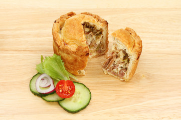 Pie and salad on a board