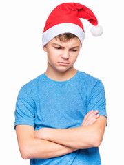 Teen boy wearing Santa Claus hat