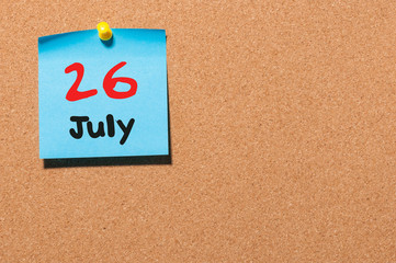 July 26th. Day 26 of month, color sticker calendar on notice board. Summer time. Empty space for text