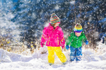 Children playing in snowy winter park