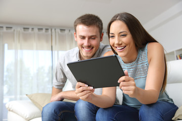 Fototapeta na wymiar Couple enjoying media content in a tablet