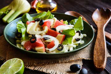 Fennel salad with grapefruit, apple, stalk celery and olives