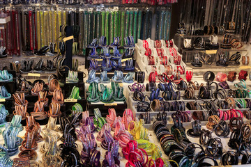 Colorful close up details of christmas fair market. Bracelet on the arm decorations for sales