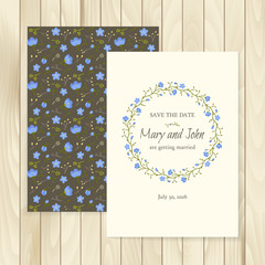 Vector template for wedding invitation on a wooden background. Layout for vintage card with wreath of blue flowers and floral ornament on the backside.