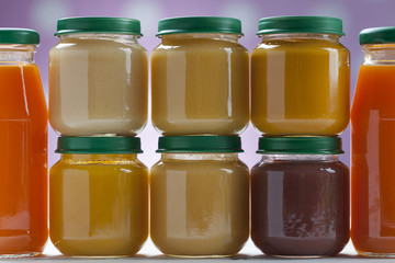 healthy ready-made baby food on a wooden table
