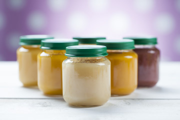 healthy ready-made baby food on a wooden table