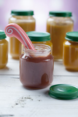 healthy ready-made baby food on a wooden table