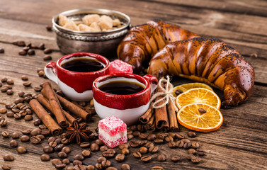 Black coffee, still life with cup and coffee beans.