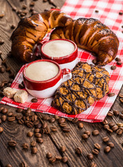 Black coffee, still life with cup and coffee beans.
