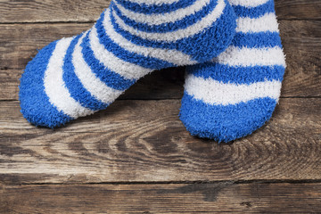 Blue Socks on Wood Background