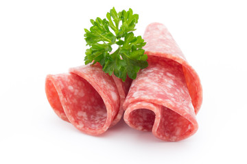Salami sausage slices isolated on white background.