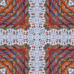 Cotton colorful textile fabric background, backdrop for scrapbook, top view. Mirror reflection collage. Seamless pattern, kaleidoscope montage for cushion, blanket, pillow, plaid, tablecloth