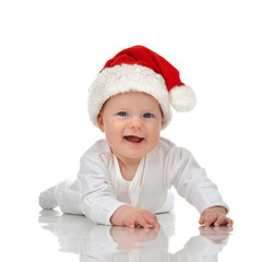 Infant child baby girl lying in red christmas santa hat happy sm