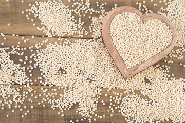 Quinoa seeds in wooden bowl