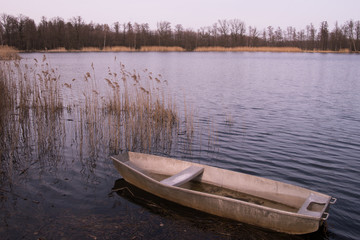 Wooden boat on the lake.