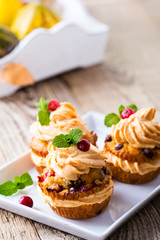 Homemade autumn cranberry pumpkin cupcakes with cream cheese 