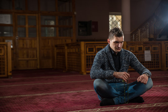 Muslim praying in mosque