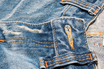 Naklejka premium old jean on wooden desk table , part of jean,