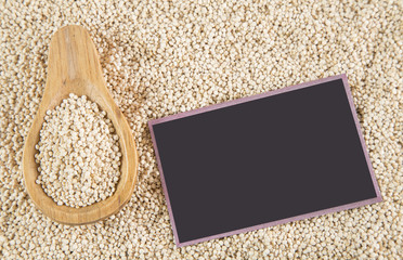 Quinoa seeds on wooden spoon
