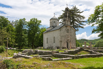 Fototapeta na wymiar Orthodox church among ruins in Cetinje, Montenegro