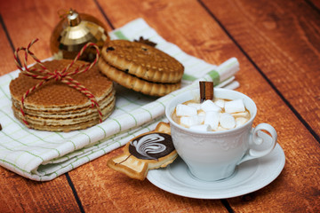 cocoa with marshmallows, cookies and waffles