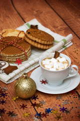 Fototapeta na wymiar cocoa with marshmallows and Christmas cookies