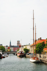 City canal with ships in Copenhagen.