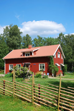 Red Swedish house in the middle of nature