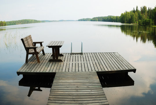 Lake with small wooden platform for rest