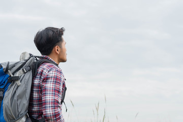 Traveler Man with backpack,Travel Lifestyle concept mountains on