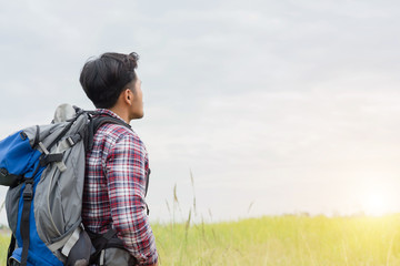 Traveler Man with backpack,Travel Lifestyle concept mountains on