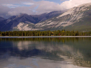 Fototapeta na wymiar Serenity at Lake Edith-Jasper Mountains reflected in the still waters of the lake in Jasper National Park.