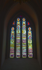 window in the church gathered from multi-colored pieces of glass