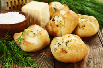 Baked buns stuffed with cheese and herbs
