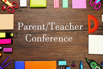 Text PARENT/TEACHER CONFERENCE  with stationary on  wooden background. School concept.