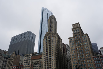 Fototapeta na wymiar Buildings from the Chicago against foggy and cloudy sky