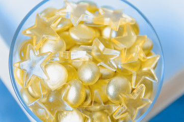 Close up image of yellow marbles