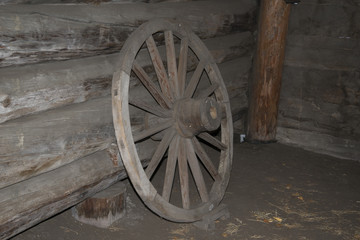 Fototapeta na wymiar Vintage wooden wagon wheel.