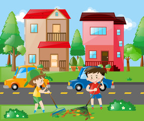 Two boys raking leaves in the yard