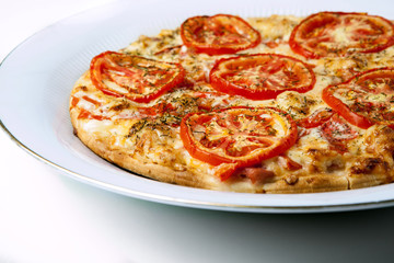 136414 ready pizza with tomatoes close up