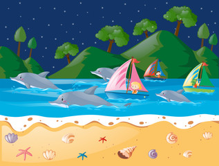 Ocean scene with dolphins and sailboat