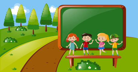 Four kids standing in park