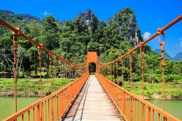Orange bridge cross the river with mountain landscape