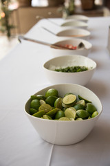Assorted toppings for Mexican tacos on a buffet