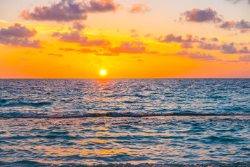 Fototapeta premium Beautiful sunset with sky over calm sea in tropical Maldives is