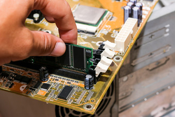 Put computer memory (RAM) in the slot of motherboard