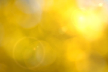 Yellow bokeh background with lens flare effect